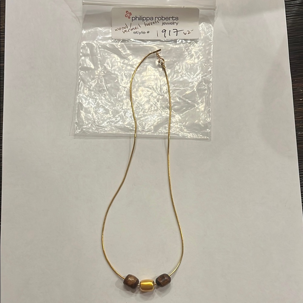 Philippe Robert’s Necklace Wood and Vermeil Barrels